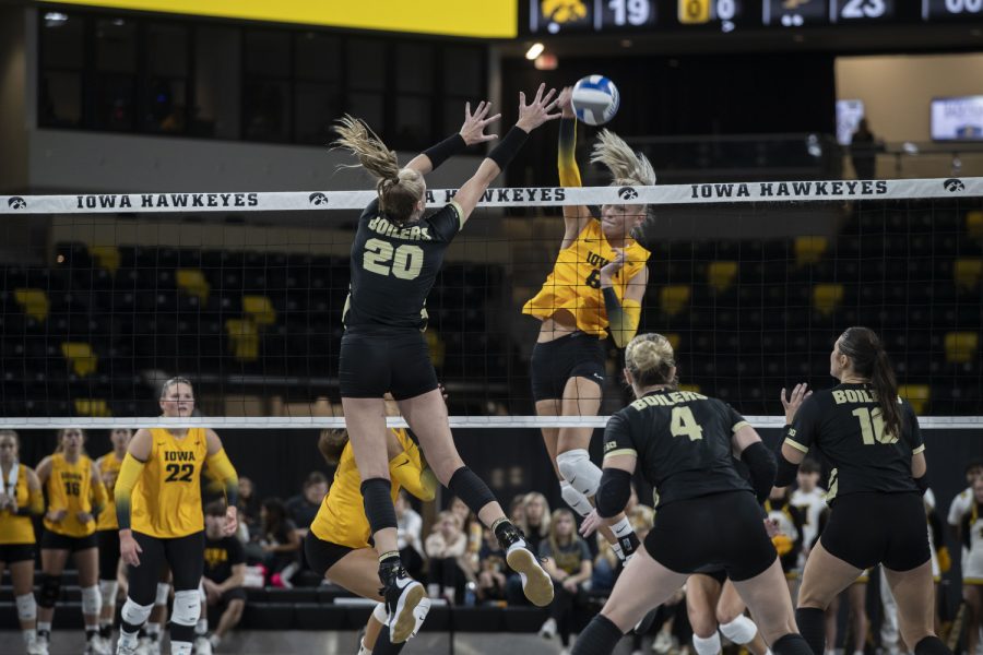 Iowa middle hitter Delaney McSweeney spikes the volleyball during a volleyball game between Iowa and Purdue at Xtream Arena in Coralville on Sunday, Sept. 25, 2022. The Boilermakers defeated the Hawkeyes 3-1. McSweeney had 9 kills during the match.
