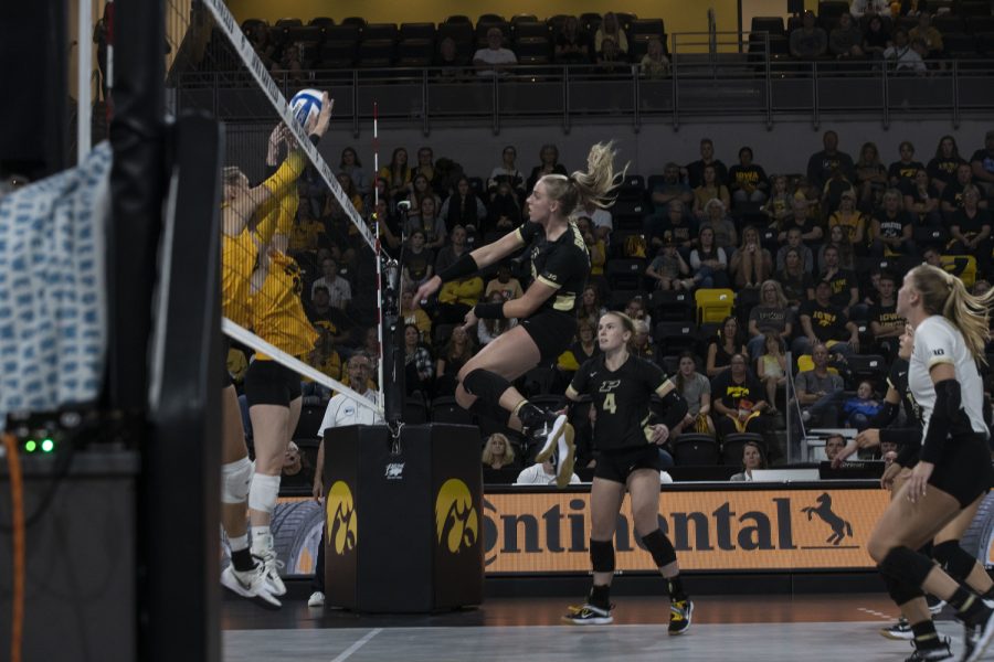 Purdue middle blocker Hannah Clayton spiking the volleyball during a volleyball game between Iowa and Purdue at Xtream Arena in Coralville, Iowa, on Sunday, Sept. 25, 2022. The Boilermakers defeated the Hawkeyes 3-1.