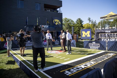Production crew films a portion of the Fox Sports Big Noon Kickoff NCAA football pregame show featuring Iowa and Michigan on the lawn by Hillcrest and Petersen Residence Hall at the University of Iowa in Iowa City on Friday, Sept. 30, 2022.