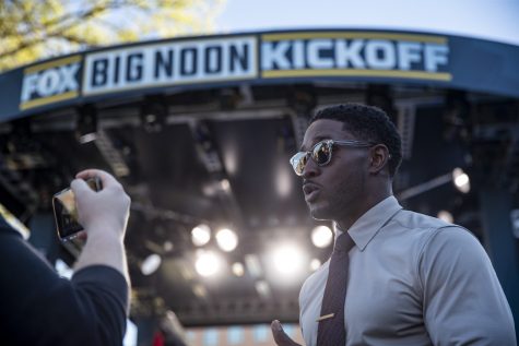 Co-host Reggie Bush answers questions during a Fox Sports Big Noon Kickoff NCAA football pregame show featuring Iowa and Michigan on the lawn by Hillcrest and Petersen Residence Hall at the University of Iowa in Iowa City on Friday, Sept. 30, 2022. Bush said Michigan has explosive playmakers, so Iowa quarterback Spencer Petras is going to be key during the game.