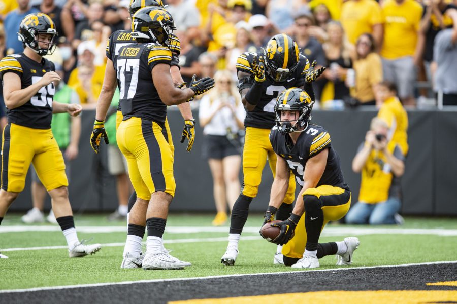 Iowa defensive back Cooper DeJean downs a punt by Iowa punter Tory Taylor near South Dakota State’s end zone during a football game between Iowa and South Dakota State at Kinnick Stadium on Saturday, Sept. 3, 2022. The Hawkeyes defeated the Jackrabbits, 7-3. DeJean had two solo tackles.