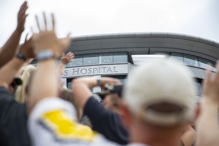 Fans wave the the University of Iowa Stead Family Childrens Hospital during a football game between Iowa and South Dakota State at Kinnick Stadium on Saturday, Sept. 3, 2022. The Hawkeyes defeated the Jackrabbits, 7-3.
