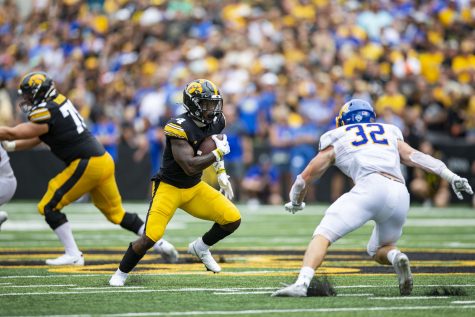 Iowa running back Leshon Williams carries the ball during a football game between Iowa and South Dakota at Kinnick Stadium on Saturday, Sept. 3, 2022. The Hawkeyes defeated the Jackrabbits, 7-3. Williams ran for 72 yards.