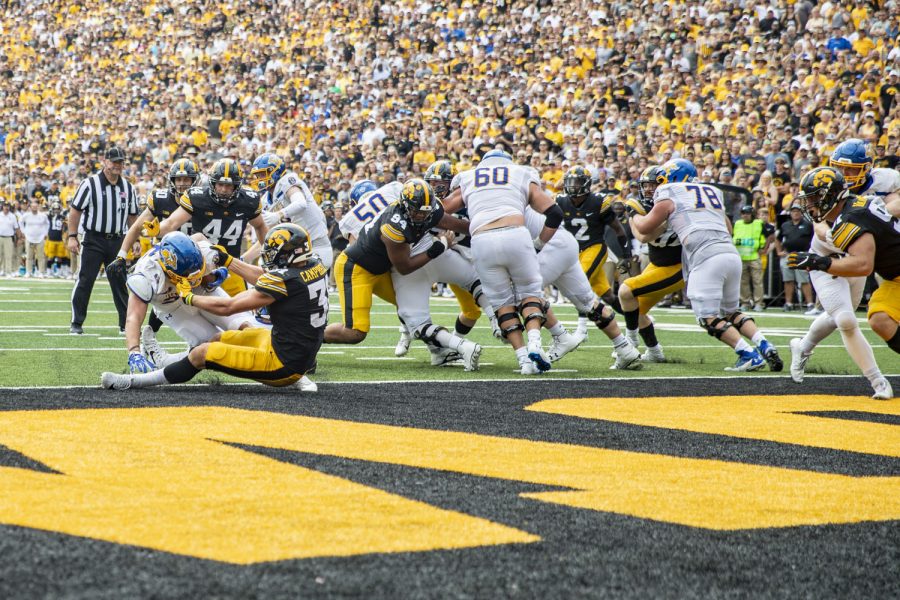 Iowa linebacker Jack Campbell tackles South Dakota State running back Isaiah Davis for a safety during a football game between Iowa and South Dakota at Kinnick Stadium on Saturday, Sept. 3, 2022. The Hawkeyes defeated the Jackrabbits, 7-3. Campbell had 11 total tackles.