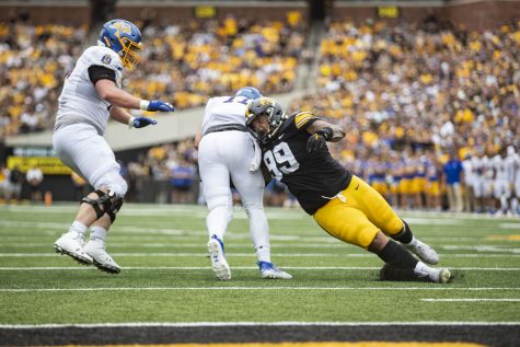 Iowa defensive lineman Noah Shannon attempts to tackle South Dakota State quarterback Mark Gronowski during a football game between Iowa and South Dakota State at Kinnick Stadium on Saturday, Sept. 3, 2022.