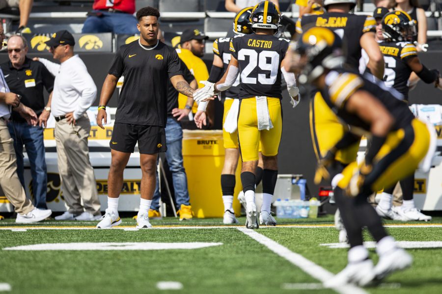 Iowa running back Gavin Williams high-fives teammates during a football game between Iowa and South Dakota State at Kinnick Stadium on Saturday, Sept. 3, 2022. Williams was expected to start today, but is dealing a reported ankle injury.