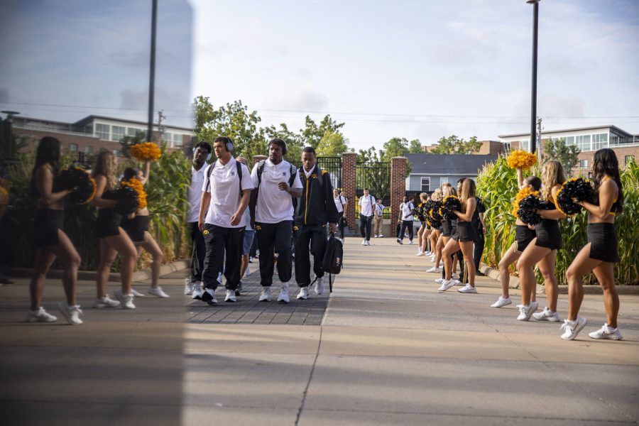 Members of the Iowa football team walk into Kinnick Stadium during the Hawk Walk before a football game between Iowa and South Dakota State on Saturday, Sept. 3, 2022. The Hawkeyes are favored to win the game. 