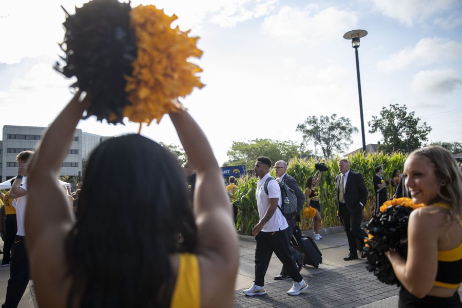 Members of the Iowa football team walk into Kinnick Stadium during the Hawk Walk before a football game between Iowa and South Dakota State on Saturday, Sept. 3, 2022. The Hawkeyes are favored to win the game.