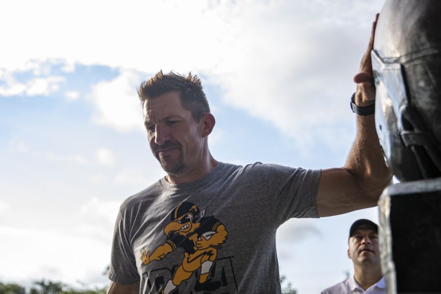 Former Iowa tight end Dallas Clark touches the Nile Kinnick statue during the Hawk Walk before a football game between Iowa and South Dakota State at Kinnick Stadium on Saturday, Sept. 3, 2022. The Hawkeyes are favored to win the game.