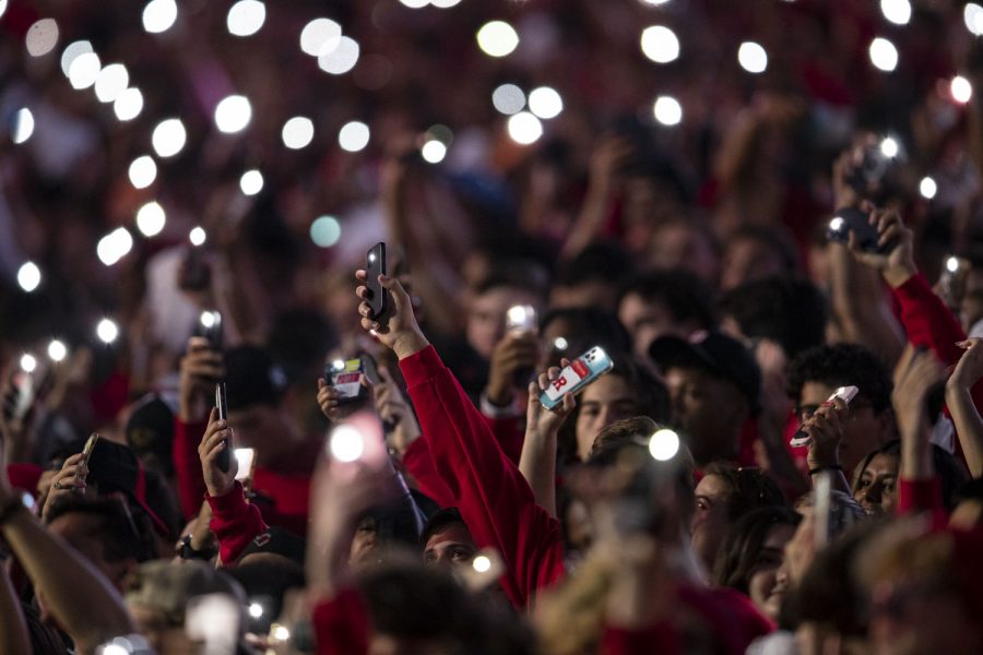 Fans hold up their phone flashlights before a football game between Iowa and Rutgers at SHI Stadium in Piscataway, N.J. on Saturday, Sept. 24, 2022. The Hawkeyes lead the Rutgers 17-3 at halftime. 