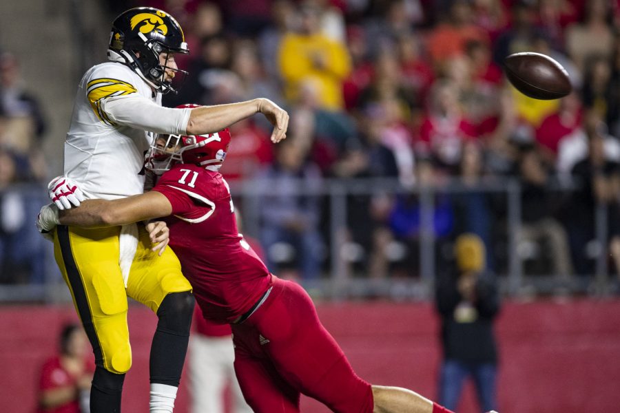 Iowa quarterback Spencer Petras gets tackled by Rutgers defensive lineman Aaron Lewis during a football game between Iowa and Rutgers at SHI Stadium in Piscataway, N.J. on Saturday, Sept. 24, 2022. The Hawkeyes lead the Rutgers 17-3 at halftime. 