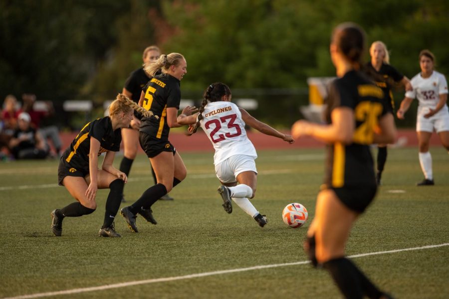Iowa State defender Jada Colbert dribbles by Iowa defender Cassie Formanek during a soccer game at the Cyclone Sports Complex in Ames on Sept. 8. The Hawkeyes lost the game, 2-1.