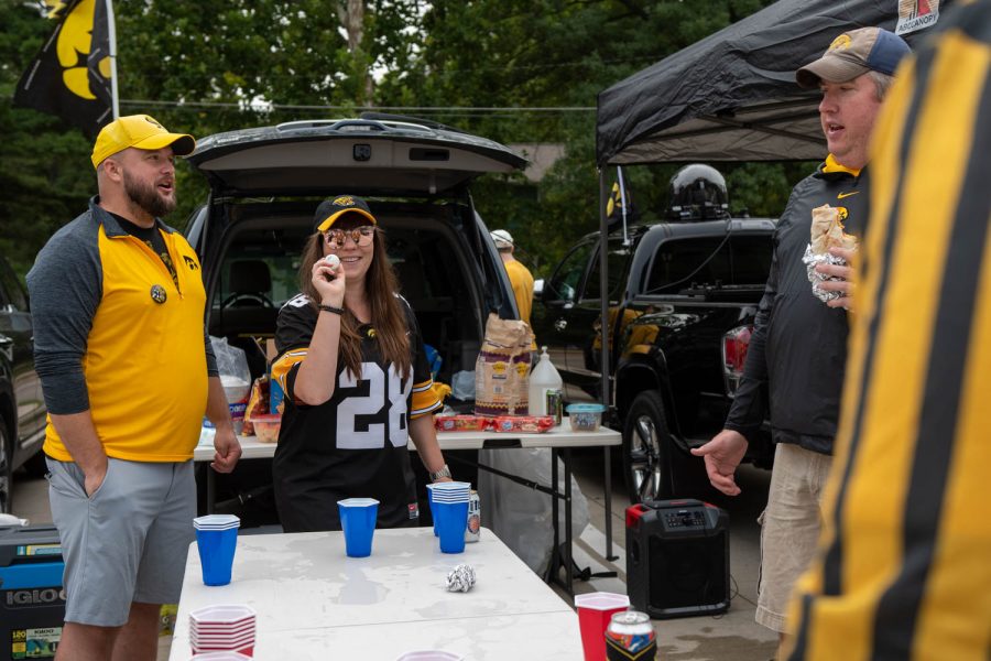 Fans play pong at a tailgating lot in Iowa City, Iowa, on Saturday, Sept. 10, 2022 for the Iowa vs. Iowa State football game.