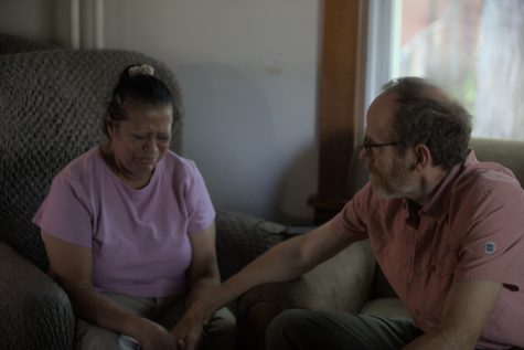 Tom Novak comforts Patricia S. Fortin as she remembers her husband. After his passing, she was unable to afford their apartment. The Iowa City Catholic worker does what it can to help people like Patricia who have nowhere else to go. Thursday, September 8, 2022. 