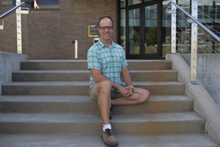 Director of higher education programming Dr. Barry Schreier poses for a portrait on the steps outside of the Lindquist Center on Sept. 19, 2022.
