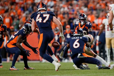 Sep 25, 2022; Denver, Colorado, USA; Denver Broncos safety P.J. Locke (6) knocks the ball away from San Francisco 49ers running back Jeff Wilson Jr. (22) as safety Kareem Jackson (22) recovers the fumble and linebacker Josey Jewell (47) looks on in the fourth quarter at Empower Field at Mile High. 