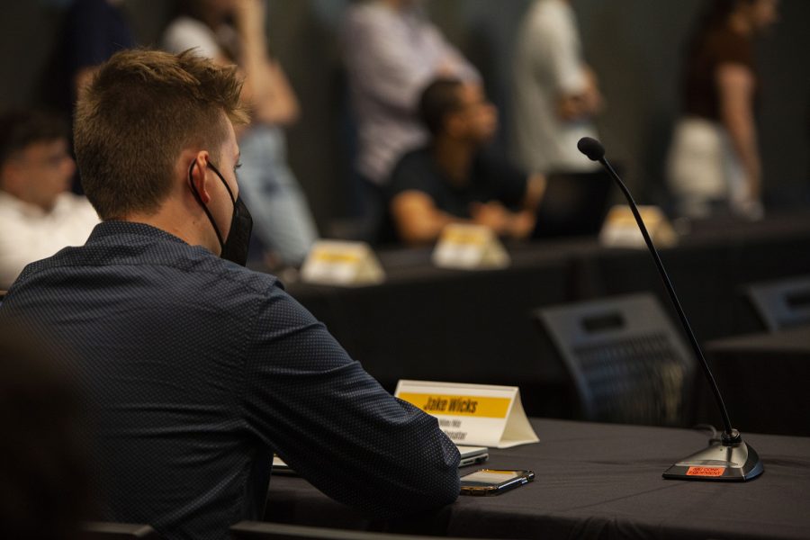 Jake Wicks listens to presentations at the Undergraduate Student Government’s meeting at the Iowa Memorial Union on Tuesday, Sept. 6, 2022. 
