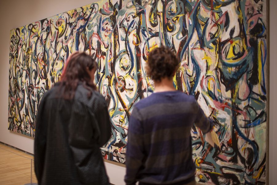 Eva Olson and Aidan Bolden point at the Jackson Pollock mural in the Stanley Museum of Art on Sunday, Sept. 11, 2022. This was Olson and Bolden’s first time walking through the museum.