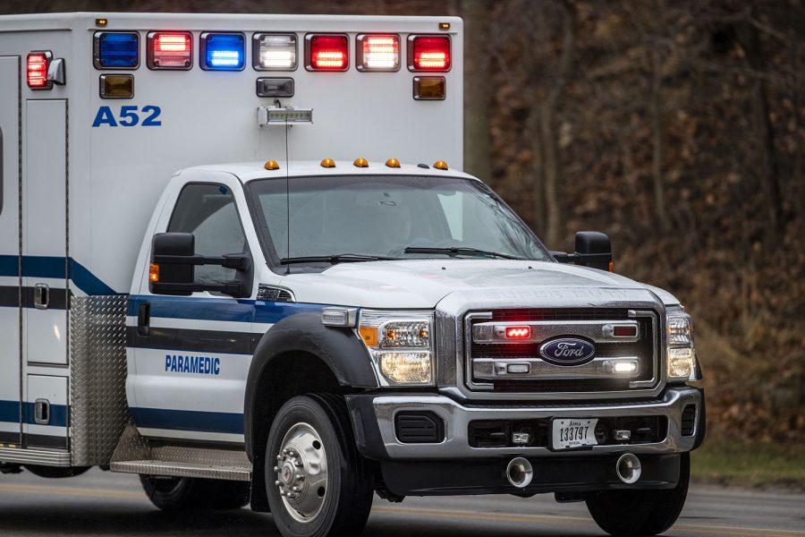An ambulance drives by the Iowa River in Iowa City on Wednesday, March 23, 2022. Ambulance ride rates went up by 11 percent since 2021.