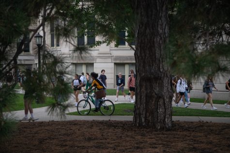 Students walk and bike to and from class at the University of Iowa’s Pentacrest on Wednesday, Sept. 21, 2022. The University of Iowa has enrolled their third largest freshman class in history, with 4,986 students in total. 