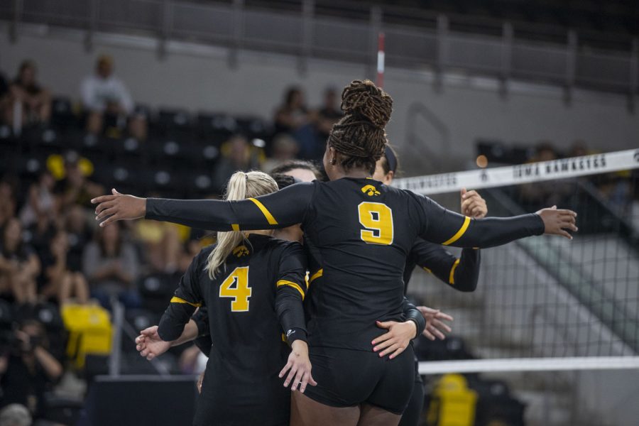 Iowa middle hitter and libero Sydney Dennis celebrate with teammates after winning the scrimmage during an Iowa women’s volleyball media conference and scrimmage at Xtream Arena in Coralville on Saturday, Aug. 20, 2022.