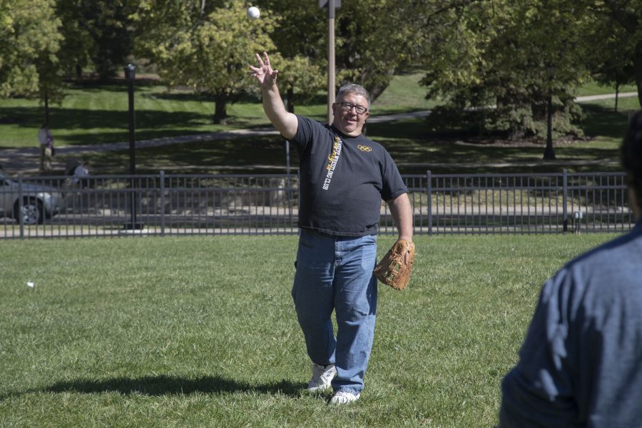 Johnson County Supervisor Rod Sullivan throws the ball to Daily Iowan reporter Alejandro Rojas during a game of catch in Hubbard Park on Wednesday, Sept. 28, 2022.