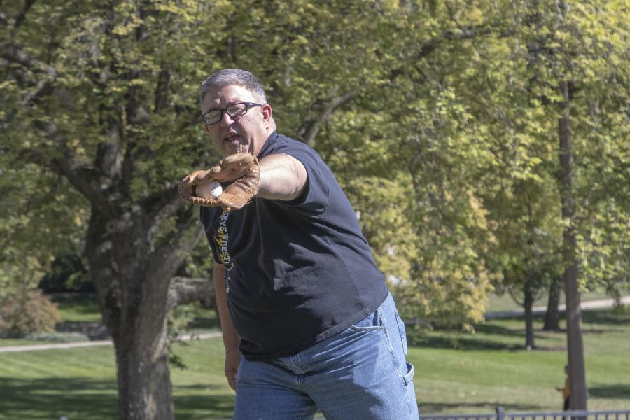 Johnson County supervisor Rod Sullivan catches a ball from Daily Iowan Reporter Alejandro Rojas during a game of catch in Hubbard Park on Wednesday, Sept. 28, 2022.