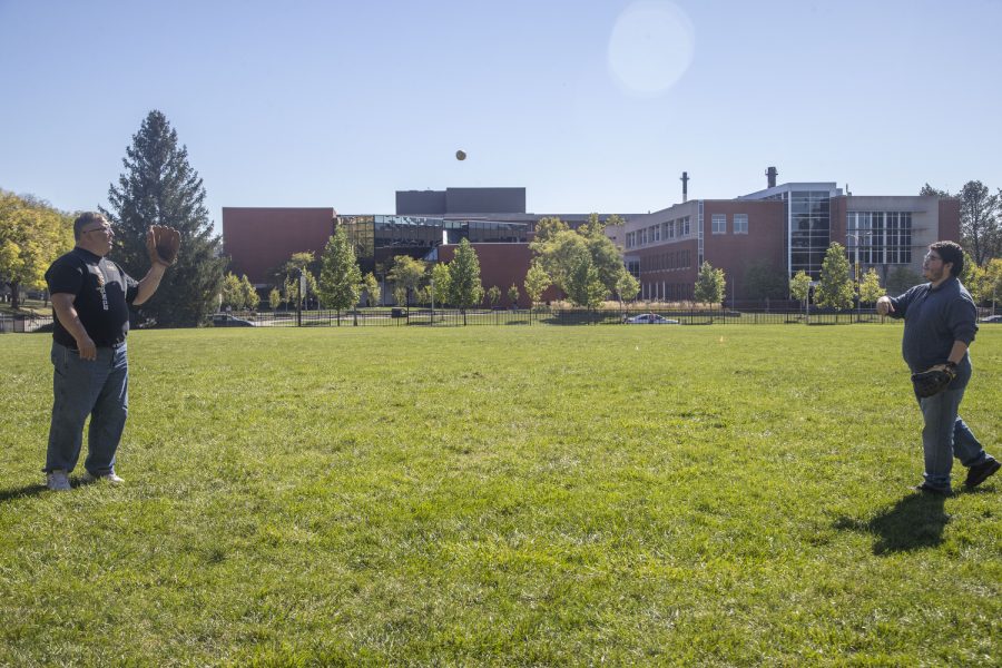 Daily Iowan reporter Alejandro Rojas throws the ball to Johnson County Supervisor Rod Sullivan during a game of catch in Hubbard Park on Wednesday, Sept. 28, 2022.