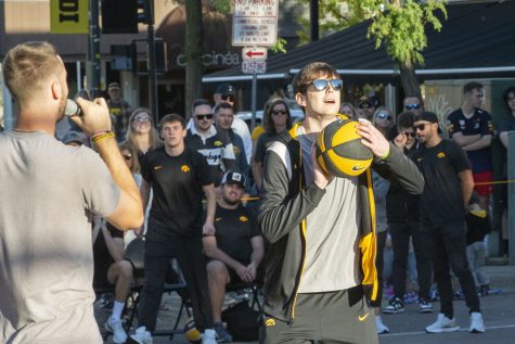 Iowa men’s guard Patrick McCaffery attempts a half-court shot during the Hawkeye Hoops from downtown on Friday, Sept. 30, 2022.