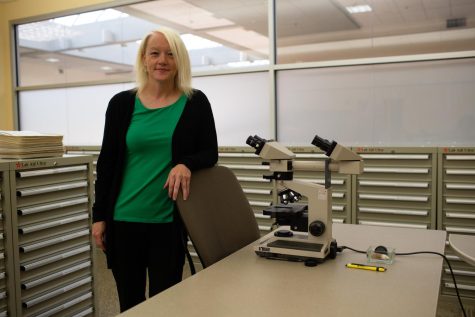 Professor Mary Charlton poses in a lab at the State Health Registry of Iowa in Iowa City on Friday, Sept. 30, 2022.