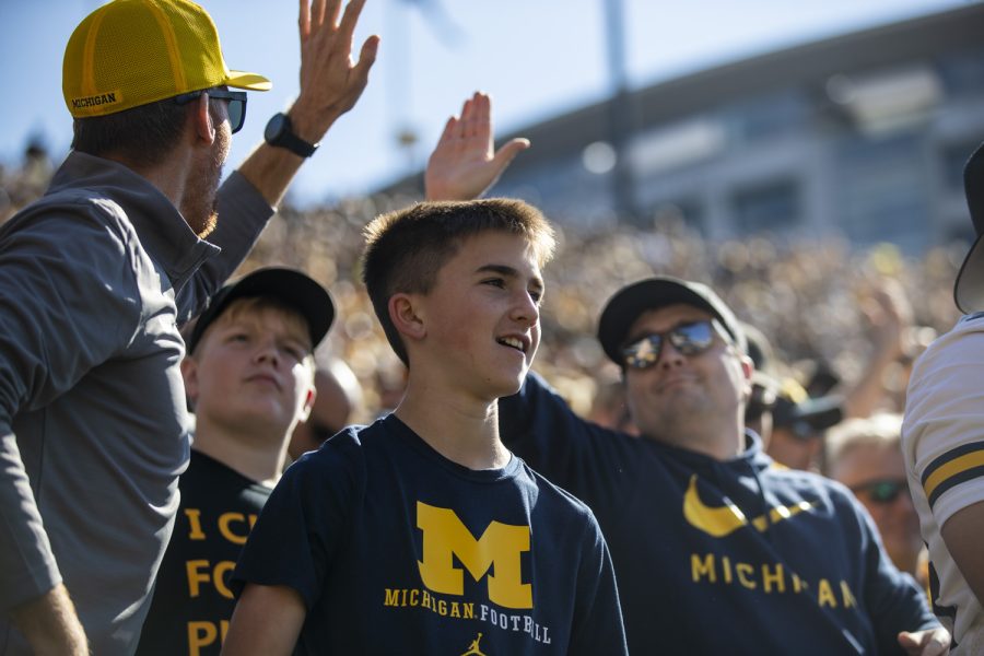 Michigan fans cheer during a football game between Iowa and No. 4 Michigan at Kinnick Stadium in Iowa City on Saturday, Oct. 1, 2022.