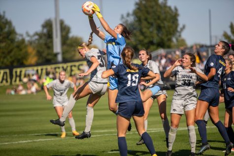 Michigan goalkeeper Izzy Nino catches the ball for a game saving block during a soccer game between Iowa and Michigan at the University of Iowa Soccer Complex in Iowa City on Sunday, Oct. 2, 2022. 