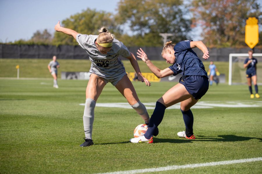 Iowa midfielder Maggie Johnston tries to steal the ball during a soccer game between Iowa and Michigan at the University of Iowa Soccer Complex in Iowa City on Sunday, Oct. 2, 2022. The Hawkeyes and Wolverines tied, 1-1.