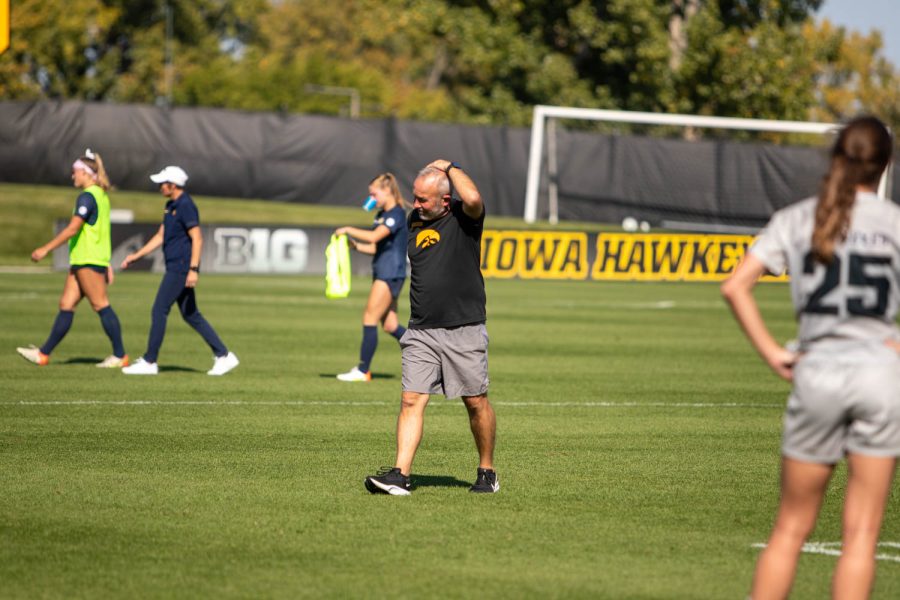 Iowa Head Coach Dave DiIanni walks across the field after a soccer game between Iowa and Michigan at the University of Iowa Soccer Complex in Iowa City on Sunday, Oct. 2, 2022. The Hawkeyes and Wolverines tied, 1-1.