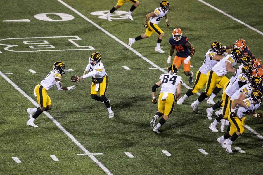 Iowa+quarterback+Spencer+Petras+hands+off+the+ball+to+running+back+Kaleb+Johnson+during+a+football+game+between+Iowa+and+Illinois+at+Memorial+Stadium+in+Champaign%2C+Ill.%2C+on+Saturday%2C+Oct.+8%2C+2022.+The+Fighting+Illini+defeated+the+Hawkeyes%2C+9-6.+Johnson+carried+the+ball+nine+times+for+26+yards.