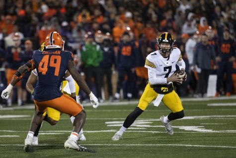 Iowa quarterback Spencer Petras looks to pass during a football game between Iowa and Illinois at Memorial Stadium in Champaign, Ill., on Saturday, Oct. 8, 2022. The Fighting Illini defeated the Hawkeyes, 9-6. Petras recorded 18 completed passes for 170 yards.