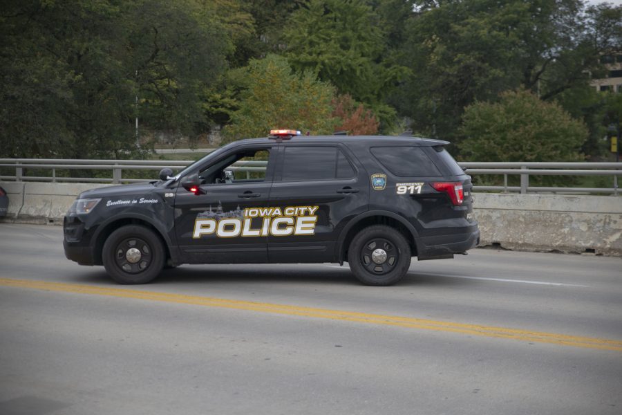 An+Iowa+City+police+car+arrives+after+a+semi-truck+got+stuck+on+the+Iowa+Avenue+bridge+on+Wednesday%2C+Oct.+5%2C+2022.