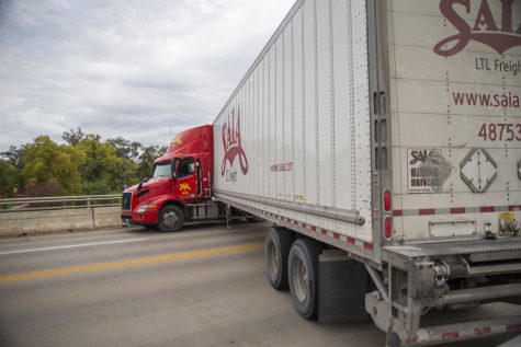A semi-truck is seen stuck on the Iowa Avenue bridge on Wednesday, Oct. 5, 2022.