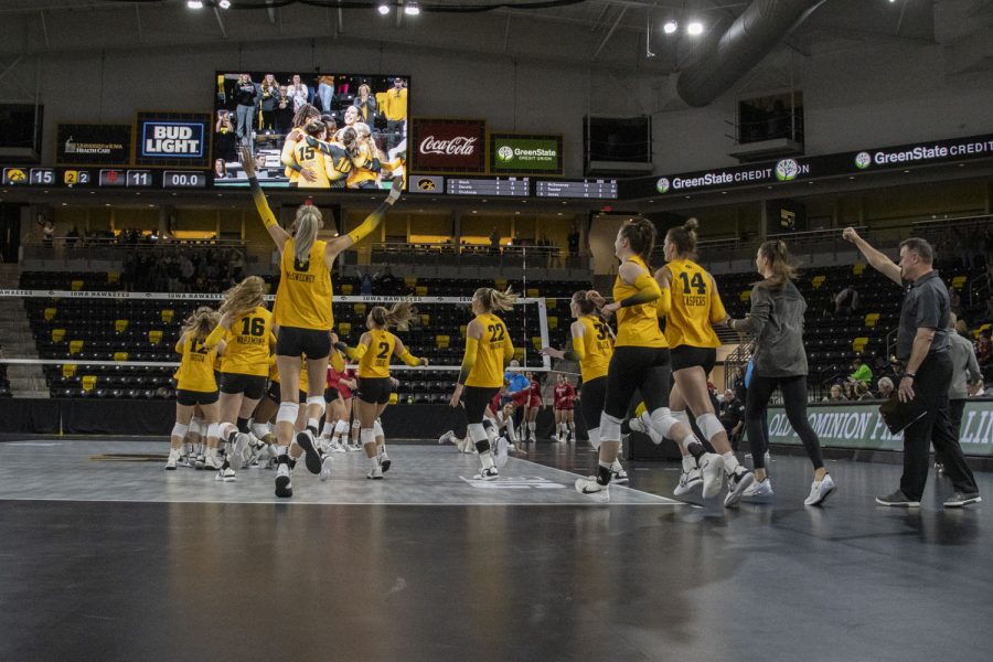 Iowa celebrates during a volleyball match between Iowa and Indiana at Xtream Arena in Coralville, Iowa, on Saturday, Oct. 8, 2022. The Hawkeyes defeated Hoosiers 3-2.