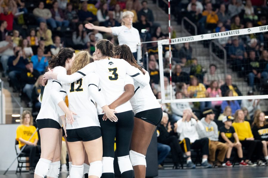 The Hawkeyes huddle up after scoring a point during a volleyball match between Iowa and Penn State at Xtream Arena in Coralville on Friday, Oct. 15, 2022. The Nittany Lions defeated the Hawkeyes, 3-2.