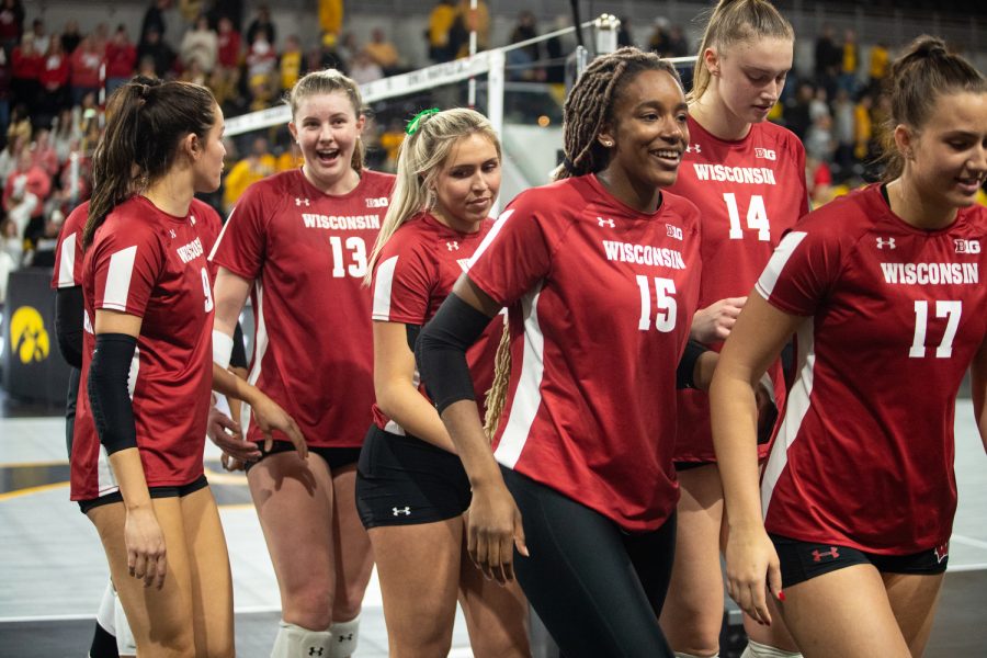 Wisconsin Badgers celebrate their win after a volleyball match between Iowa and Wisconsin at Xtream Arena in Coralville on Friday, Oct. 14, 2022. The Badgers defeated the Hawkeyes, 3-0.