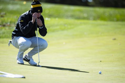 Iowa’s Ian Meyer lines up a putt during the Iowa Fall Classic at Blue Top Ridge Golf Course in Riverside, Iowa, on Monday, Oct. 17, 2022. Meyer finished the tournament 24th after shooting 11 over par. The Hawkeyes defeated eight other teams to win the tournament, shooting 20 over par.