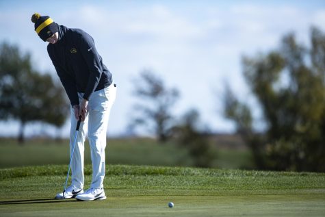 Iowa’s Ronan Kleu putts a ball during the Iowa Fall Classic at Blue Top Ridge Golf Course in Riverside, Iowa, on Monday, Oct. 17, 2022. The Hawkeyes defeated eight other teams to win the tournament, shooting 20 over par.
