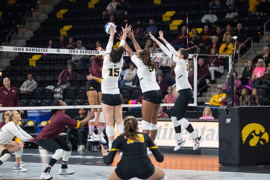 Iowa middle hitter Amiya Jones blocks the ball during a volleyball match between Iowa and Minnesota on Wednesday, October 19, 2022. The Gophers beat the Hawkeyes, 3-0.