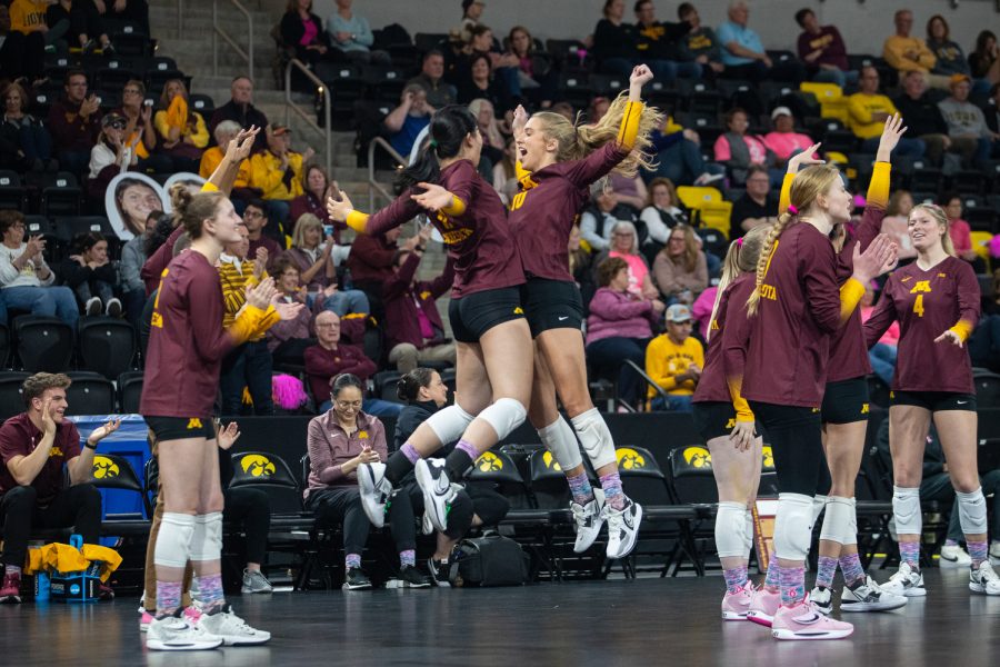 Gophers celebrate together during a volleyball match between Iowa and Minnesota on Wednesday, October 19, 2022. The Gophers beat the Hawkeyes, 3-0.
