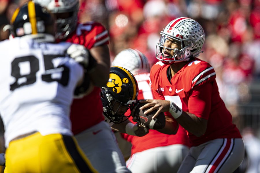 Iowa defensive lineman Joe Evans hits C.J. Stroud while forcing a fumble during a football game between Iowa and No. 2 Ohio State at Ohio Stadium in Columbus, Ohio, on Saturday, Oct. 22, 2022. (Jerod Ringwald/The Daily Iowan)