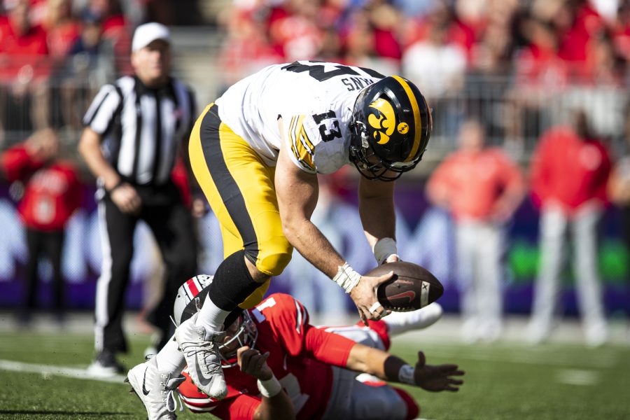 Iowa defensive lineman Joe Evans scoops up a fumble from Ohio State quarterback C.J. Stroud during a football game between Iowa and No. 2 Ohio State at Ohio Stadium in Columbus, Ohio, on Saturday, Oct. 22, 2022. Evans scored a touchdown on the play. The Buckeyes defeated the Hawkeyes, 54-10.