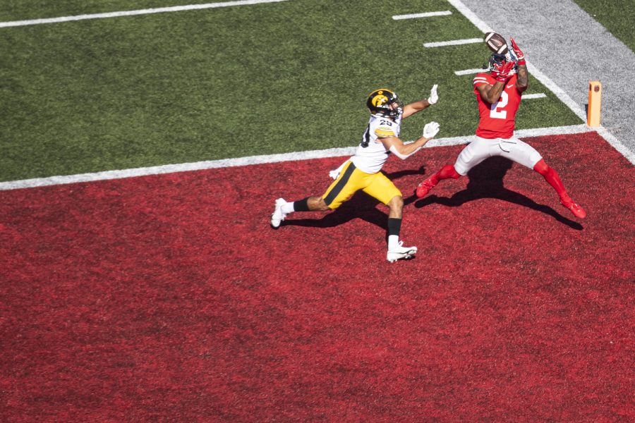 Ohio State wide receiver Emeka Egbuka catches a touchdown pass over Iowa defensive back Sebastian Castro during a football game between Iowa and No. 2 Ohio State at Ohio Stadium in Columbus, Ohio, on Saturday, Oct. 22, 2022. Egbuka caught six passes for 80 yards and a touchdown. The Buckeyes defeated the Hawkeyes, 54-10.