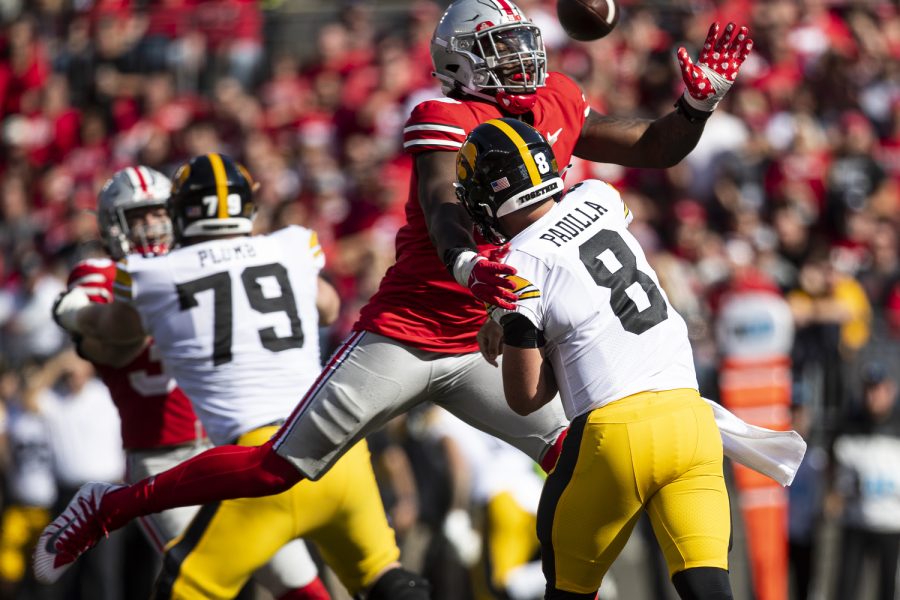 Ohio State defensive end Zach Harrison pressures Iowa quarterback Alex Padilla’s throw attempt during a football game between Iowa and No. 2 Ohio State at Ohio Stadium in Columbus, Ohio, on Saturday, Oct. 22, 2022. Padilla threw an interception on the play. The Buckeyes defeated the Hawkeyes, 54-10.