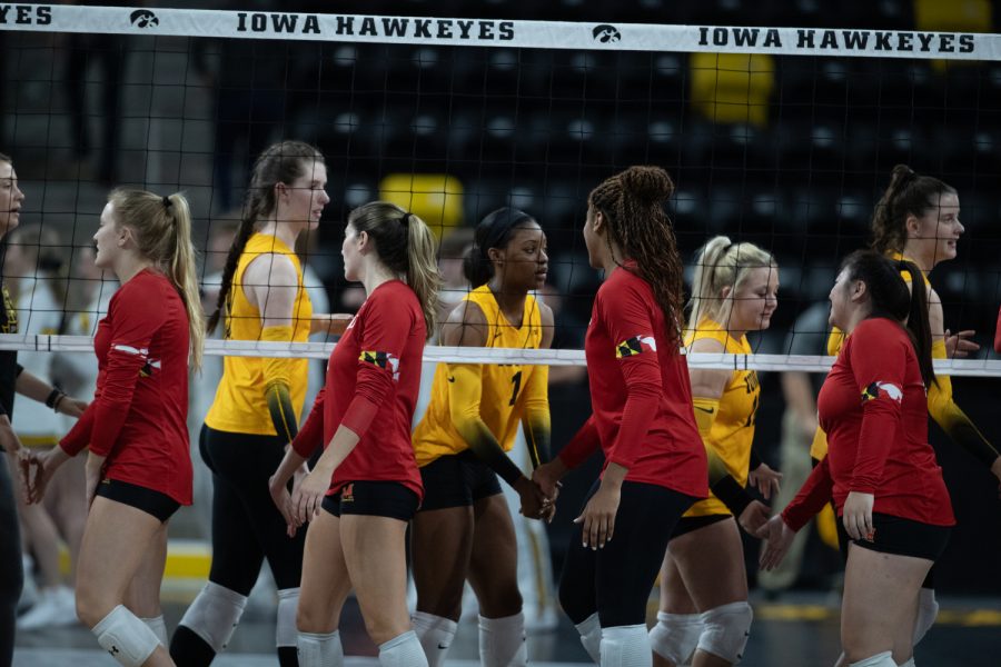 Iowa and Maryland teams shake hands after a volleyball game between Iowa and Maryland at Xtream Arena in Coralville on Thursday, Oct. 27, 2022. The Terrapins defeated the Hawkeyes, 3-1.